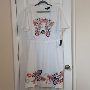 White dress with embroidered flowers